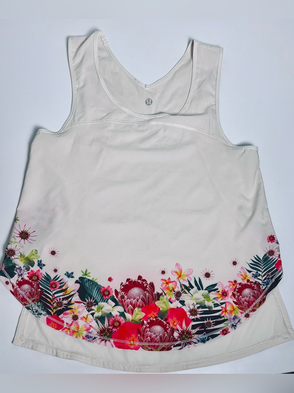 Lululemon Tank Top with floral design. Light weight fabric, off white colour.